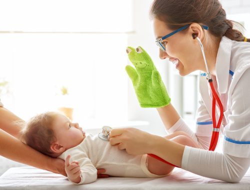 doctor examining a baby in a hospital
